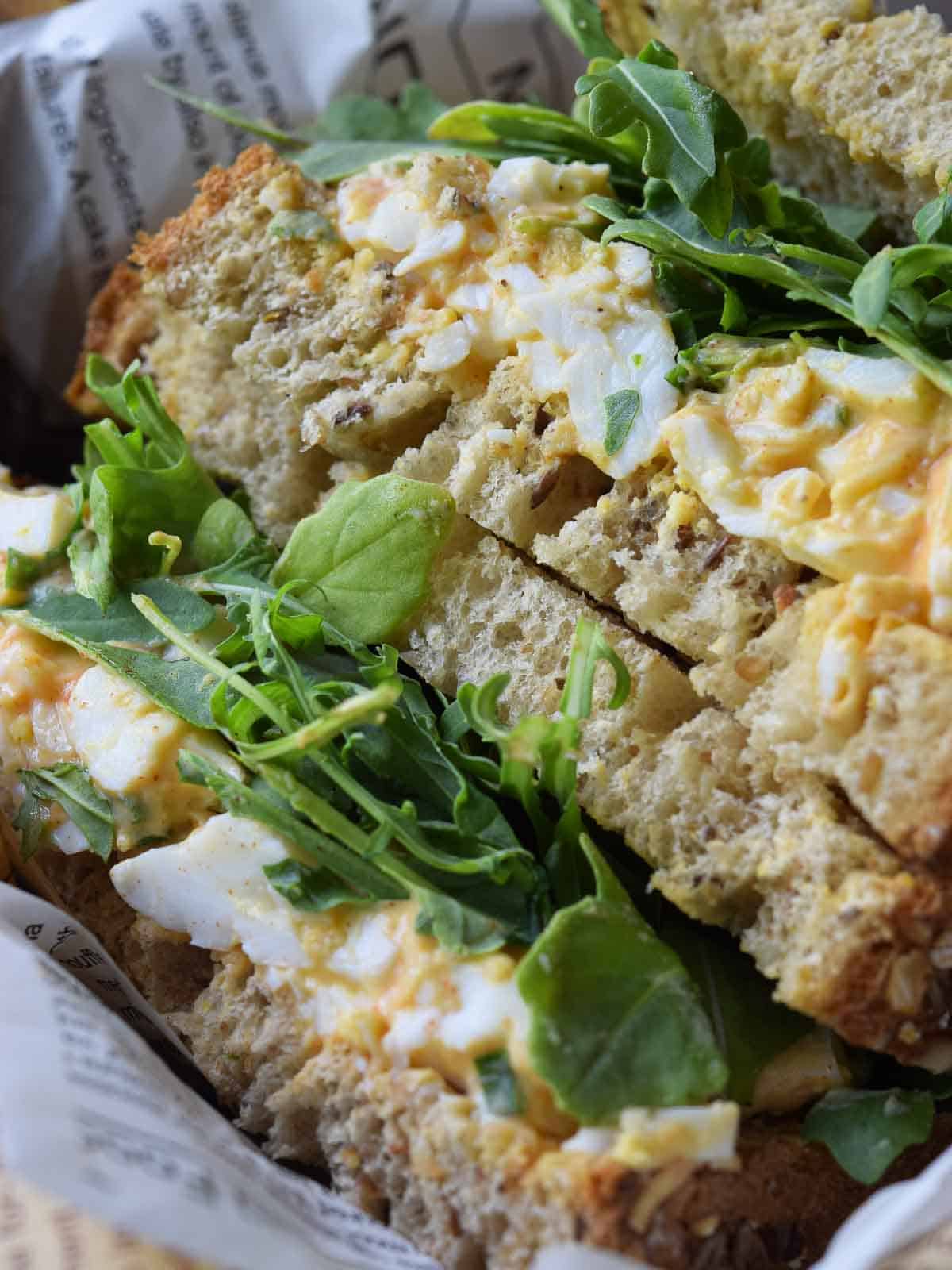 Egg salad sandwich in a basket.