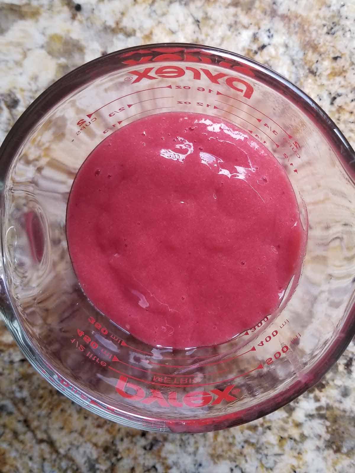 overhead view of plum puree in a pyrex glass