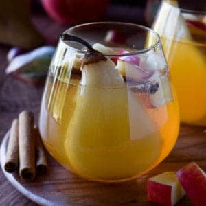Close-up of apple and pear sangria in a glass.