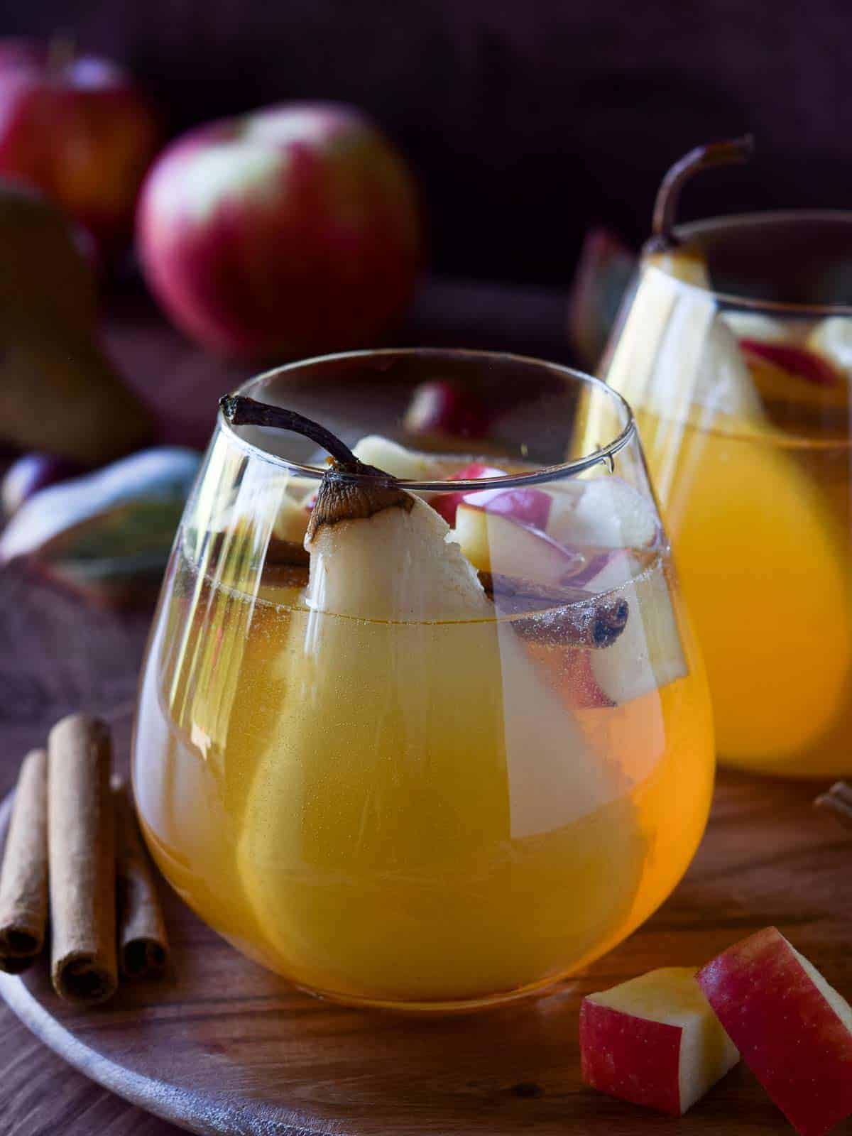 Close-up of apple and pear sangria in a glass.