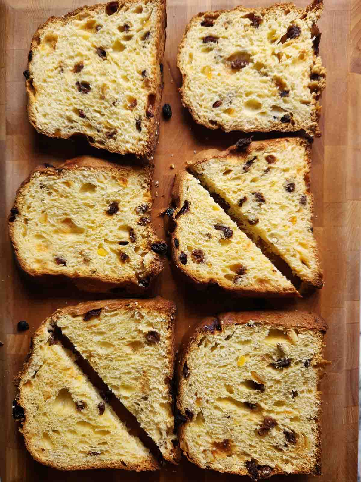 Panettone bread cut on a cutting board.