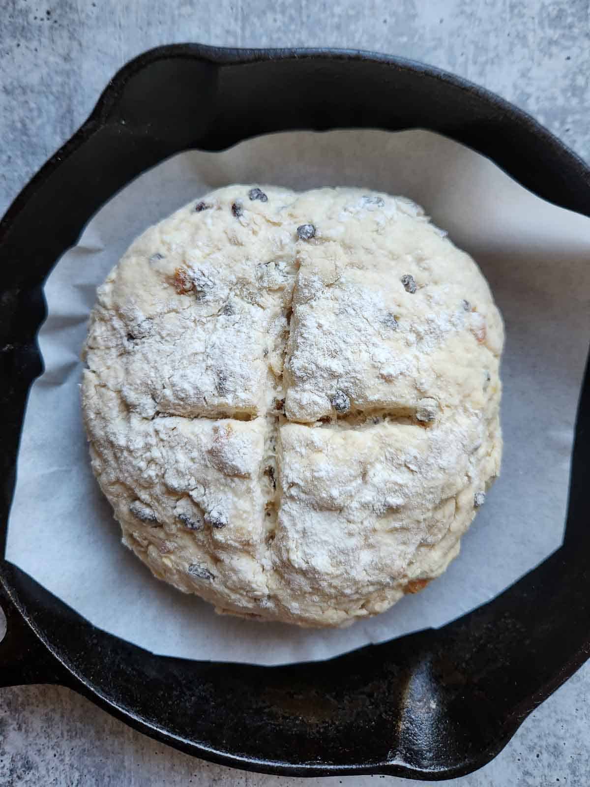 Irish soda bread dough in a cast iron skillet.