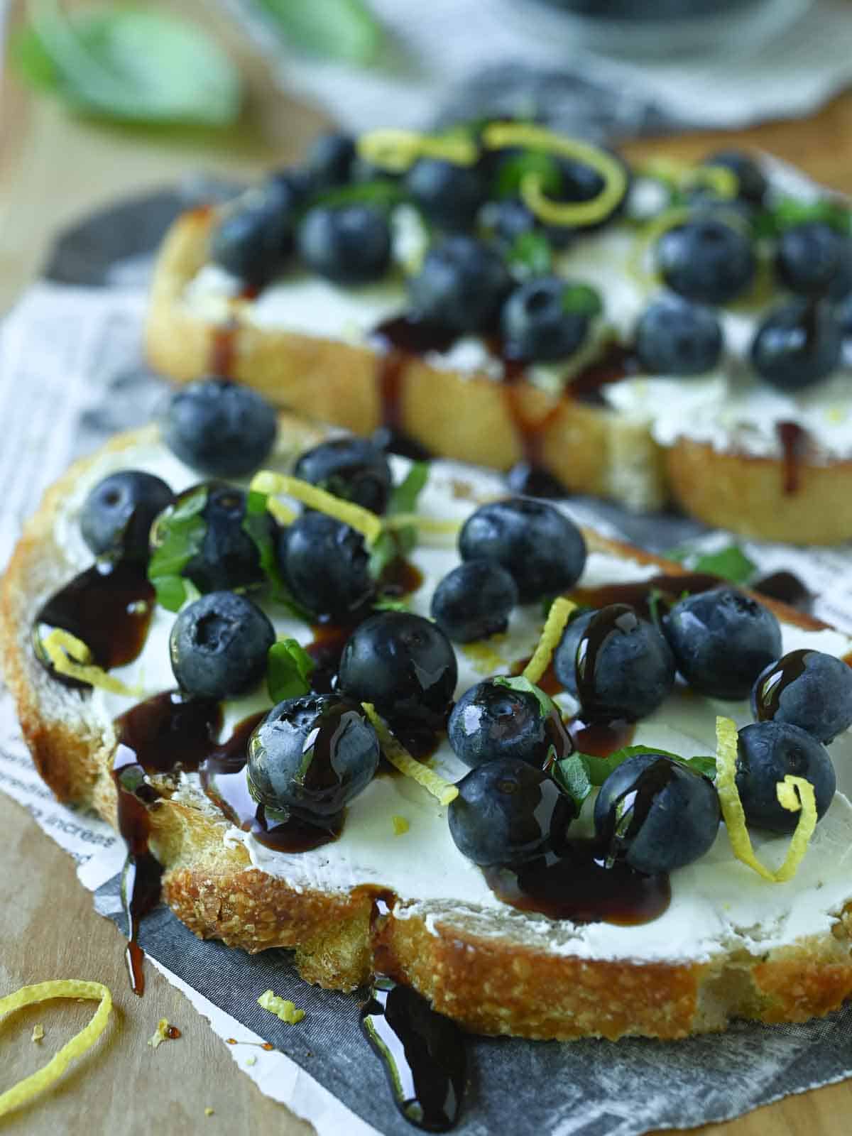 Close-up on blueberry lemon toast on a cutting board.