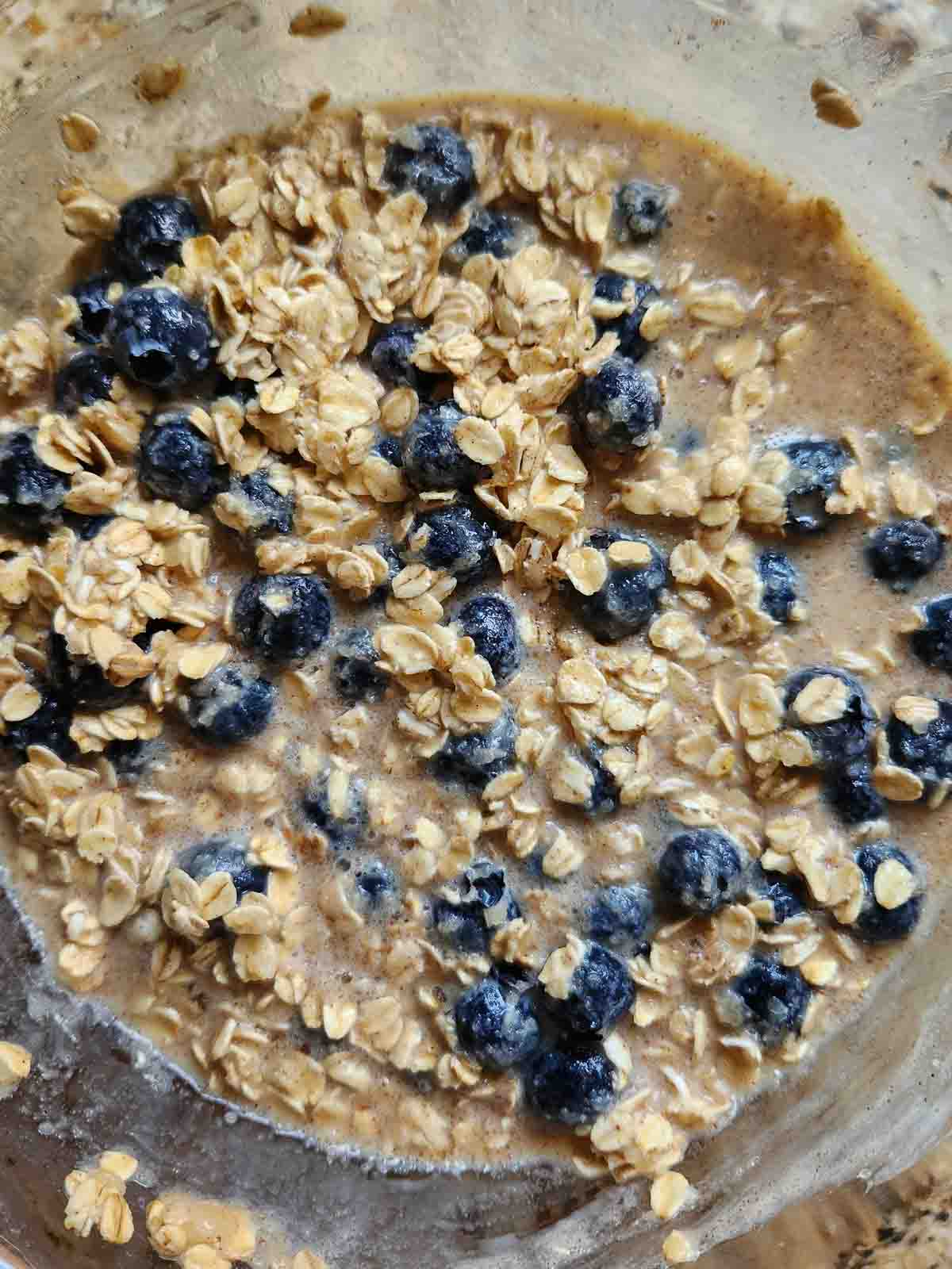 Overhead of baked oatmeal batter in a bowl.