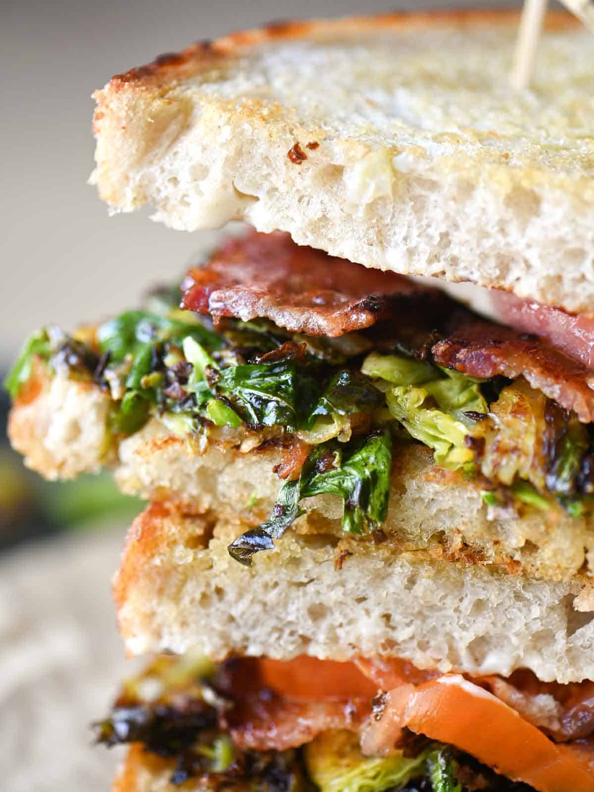 Close-up of Brussels sprouts tucked in a sandwich.