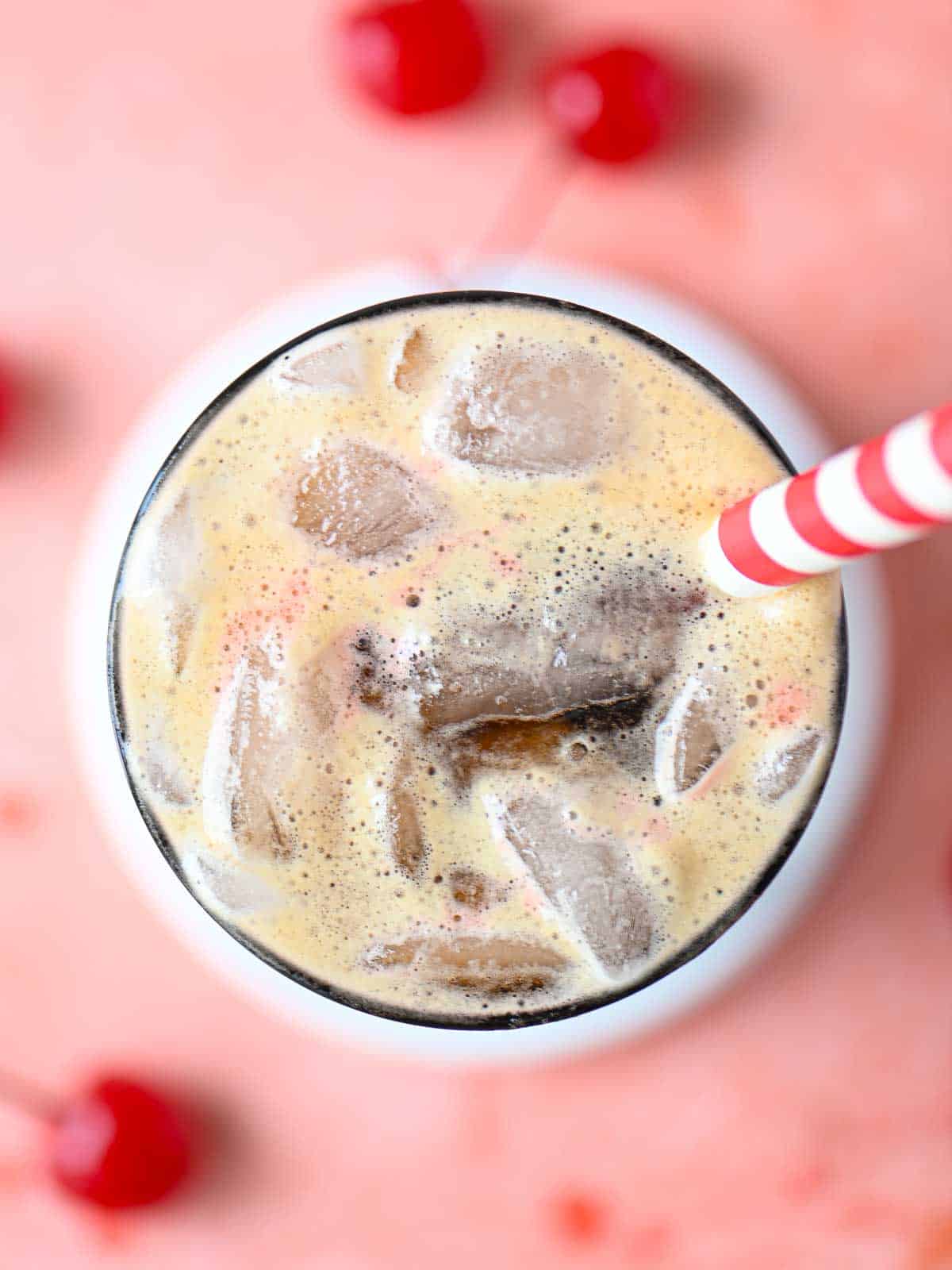 Overhead of the top of a cherry americola, highlighting the carbonation.