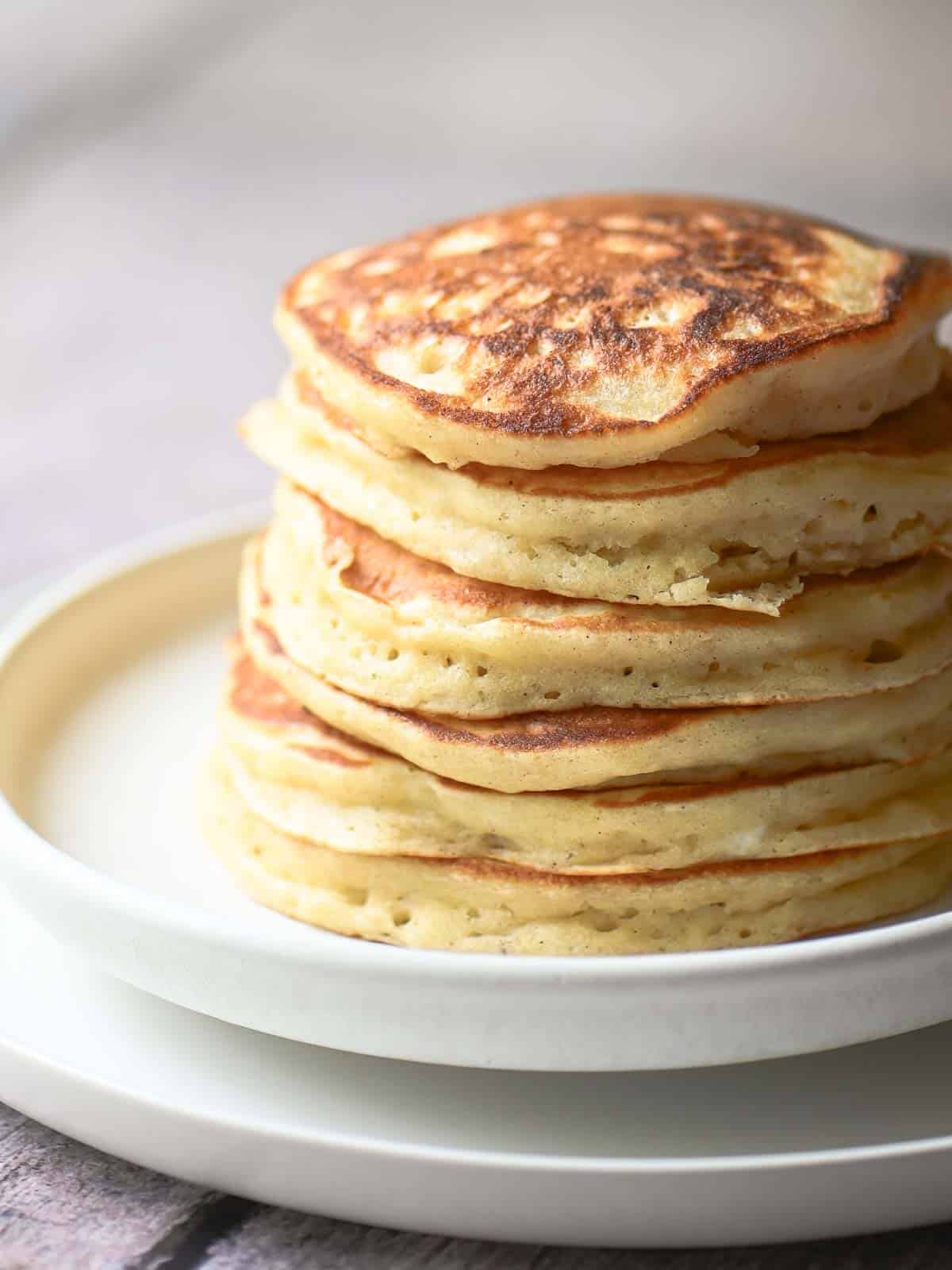 Delicious stack of golden-brown pancakes perfect for brunch. Freshly cooked with a light, airy textu.