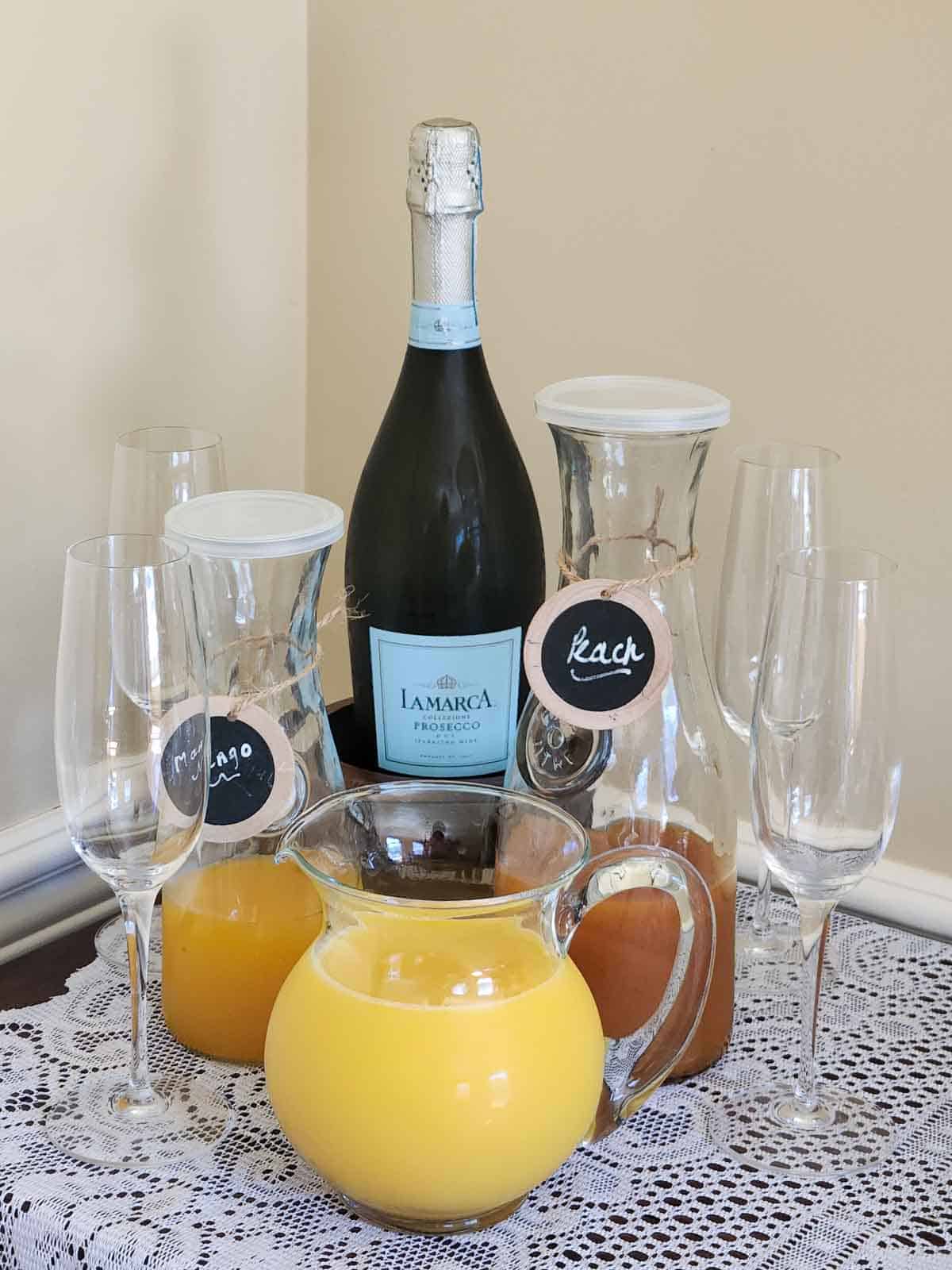 Bellini bar with juices, champagne and glasses.