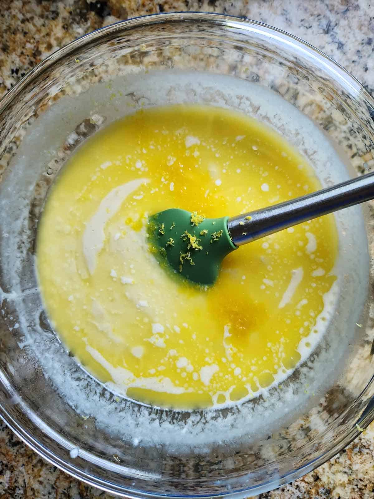Wet ingredients in a clear bowl.