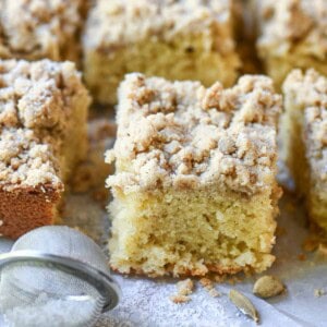 Close up of coffee cake showing the sponge and crumb topping.