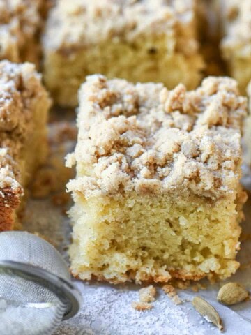 Close up of coffee cake showing the sponge and crumb topping.