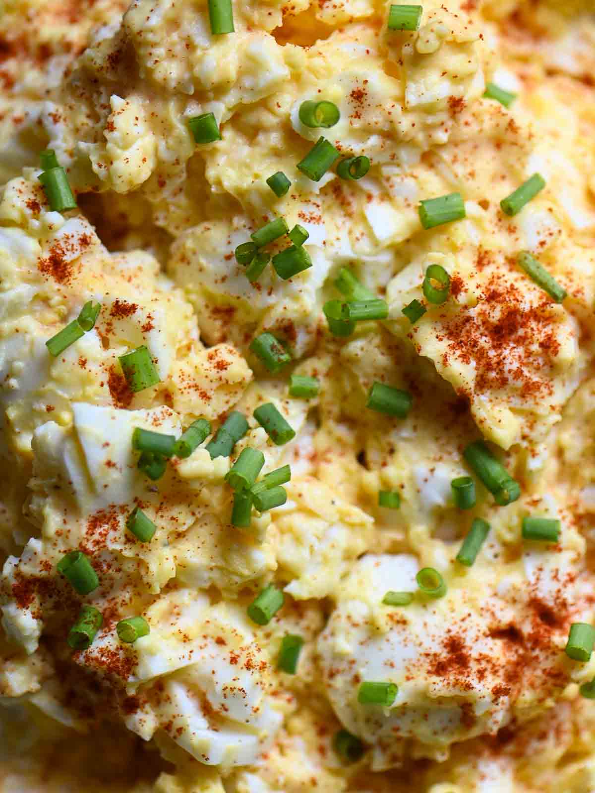Egg salad close-up with chives.