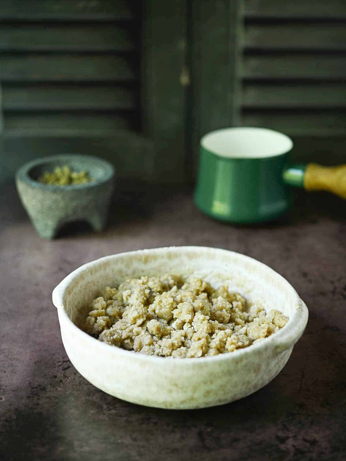 Streusel topping in a beige bowl.