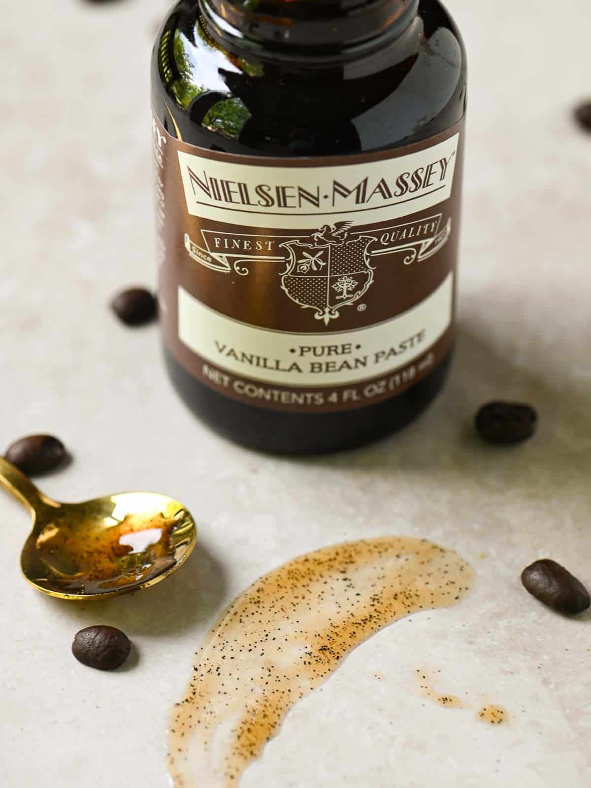 A smear of vanilla bean paste showing the golden bean flecks.