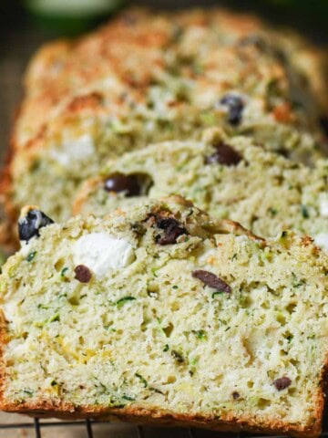 Slices of zucchini bread leaning up against each other.